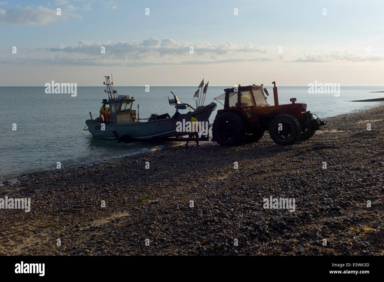 Fishing boat landing on beach, Normandy, France Stock Photo