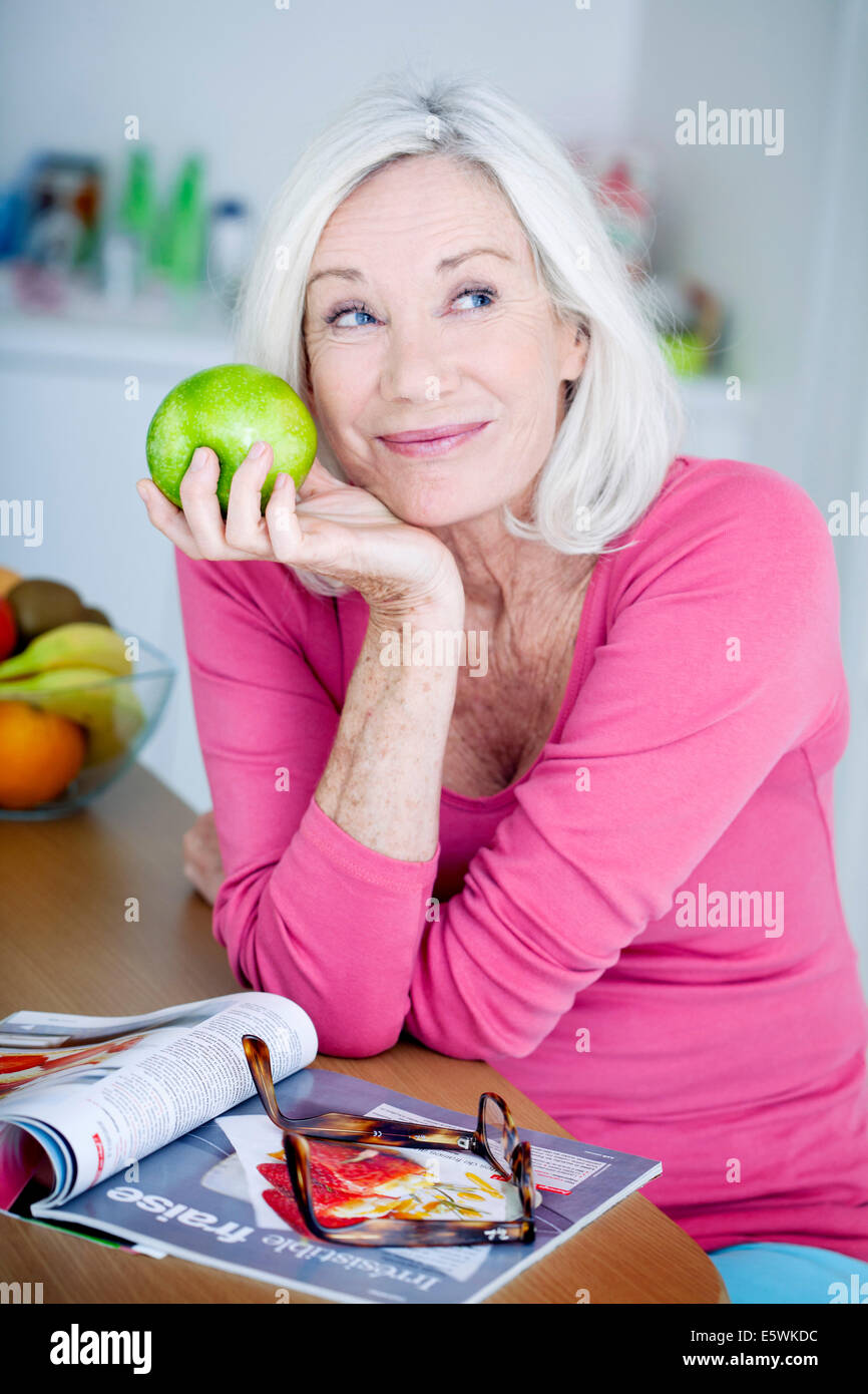 Elderly person eating fruit Stock Photo Alamy