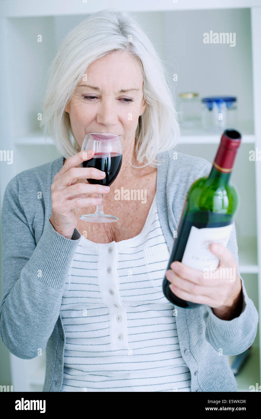 Older woman drinking wine alone hires stock photography and images Alamy