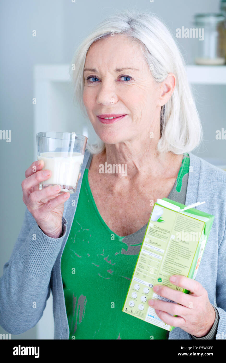 Elderly person with cold drink Stock Photo