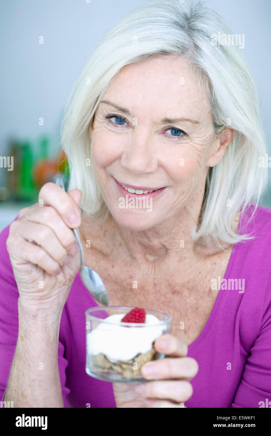 Elderly person snacking Stock Photo