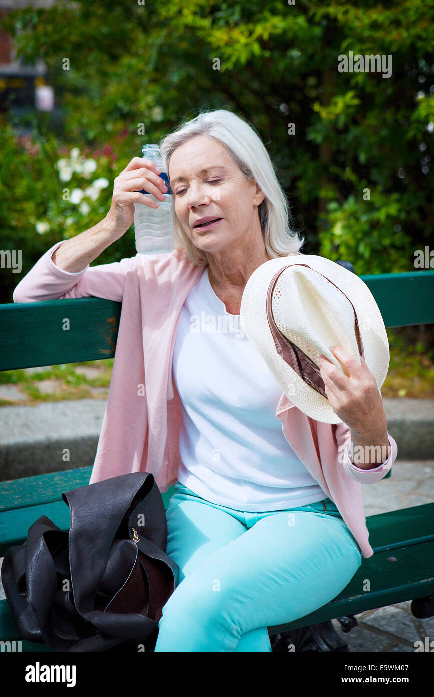 Warm weather, elderly person Stock Photo