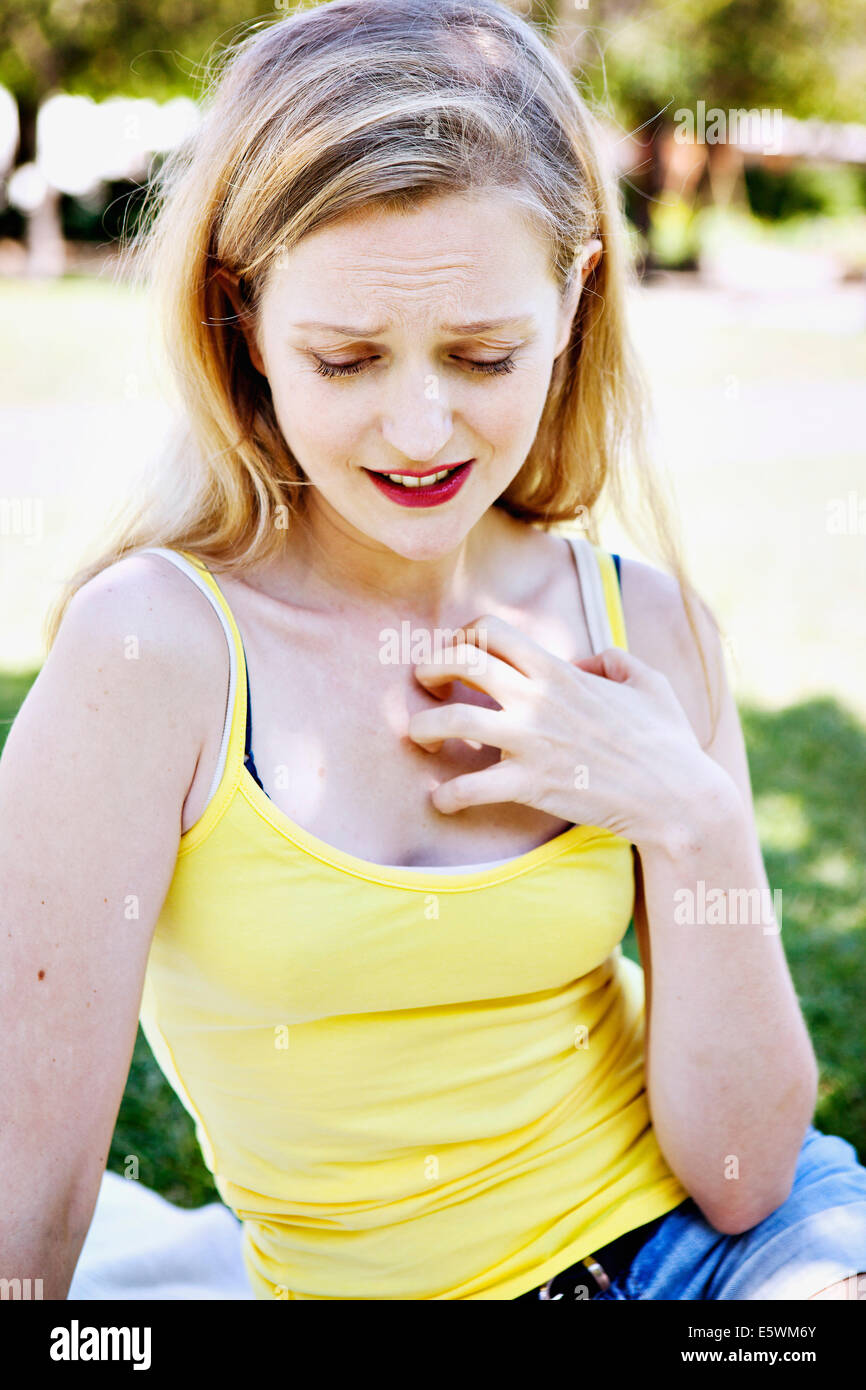 Itching in a woman Stock Photo Alamy