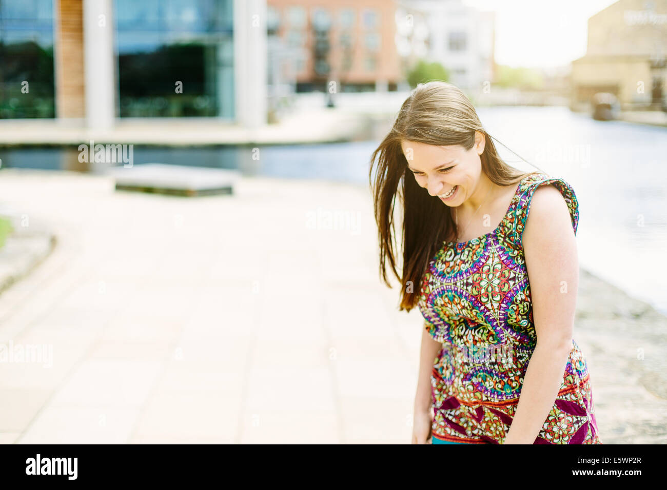 Woman standing by canal Stock Photo - Alamy