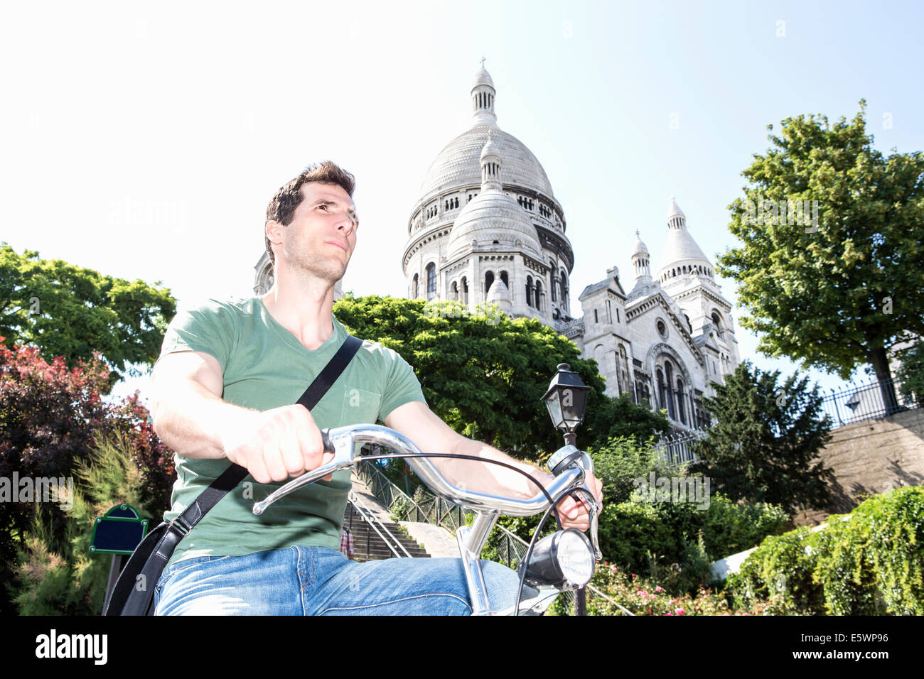 Mid adult male cycling in Paris, France Stock Photo
