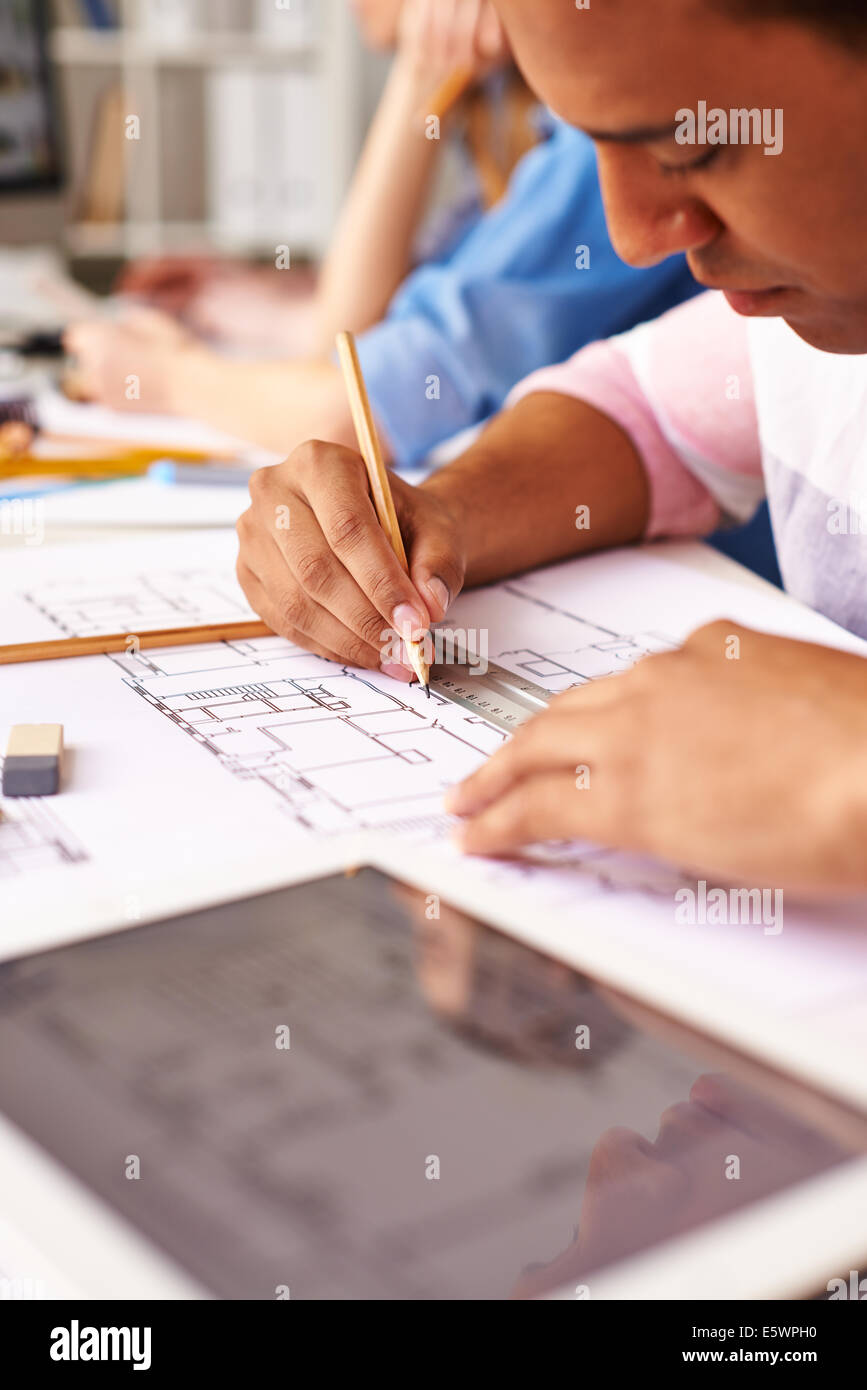 Hands of smart guy making sketch at lesson Stock Photo