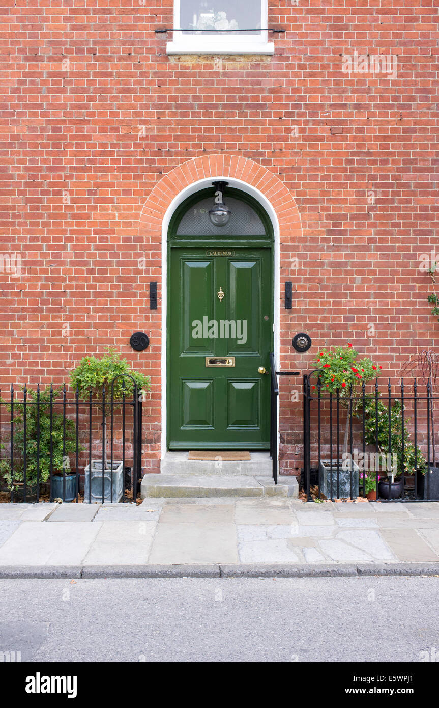 Green door at the entrance to a UK residence Stock Photo - Alamy