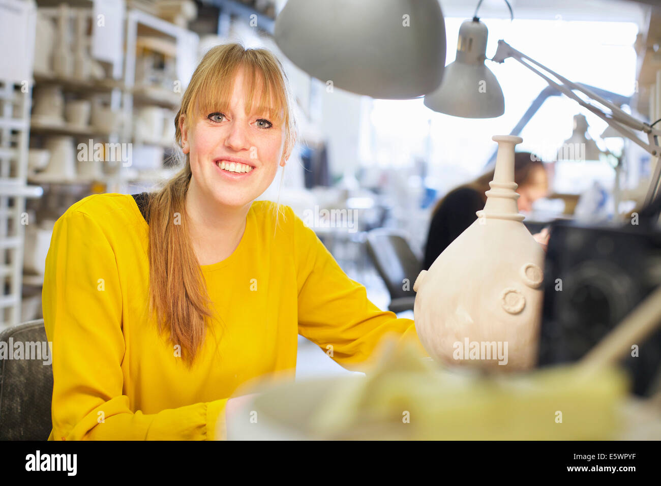 Female potter working in ceramic workshop Stock Photo - Alamy
