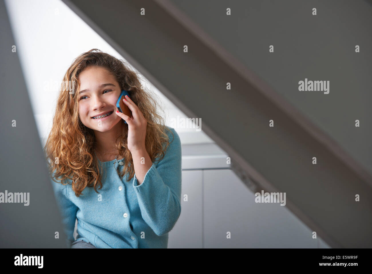 Young girl using mobile phone Stock Photo