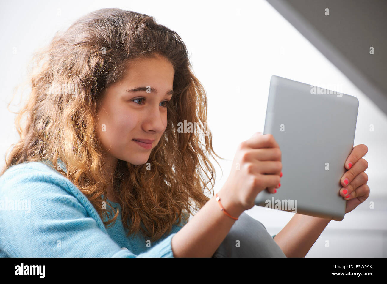 Young girl using digital tablet Stock Photo