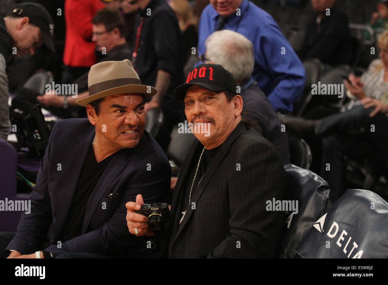 Friday January 31 2014; Celebs out at the Lakers game. Charlotte Bobcats Pacers defeated the Los Angeles Lakers by the final score of 110-100 at Staples Center in Los Angeles CA Featuring: George Lopez,Danny Trejo Where: Los Angeles California United Stat Stock Photo