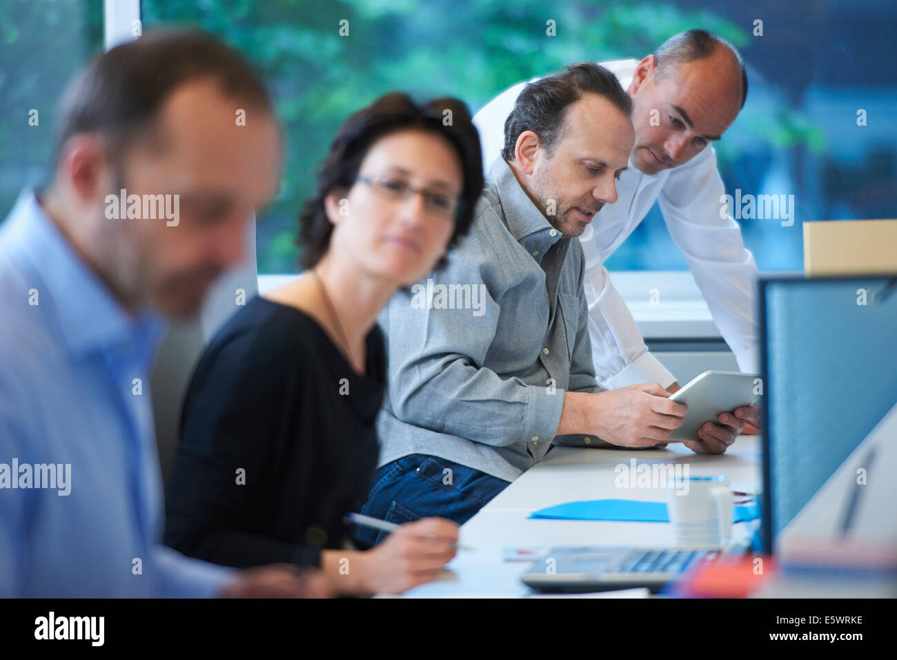 Businesspeople working in office Stock Photo