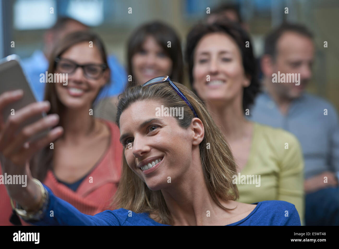 Group of people taking self portrait photograph Stock Photo