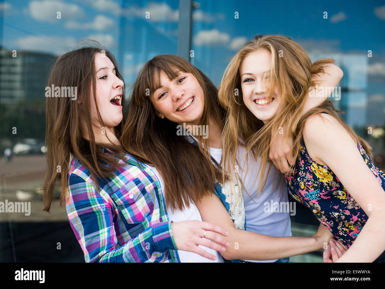 Portrait of three young women in a row Stock Photo