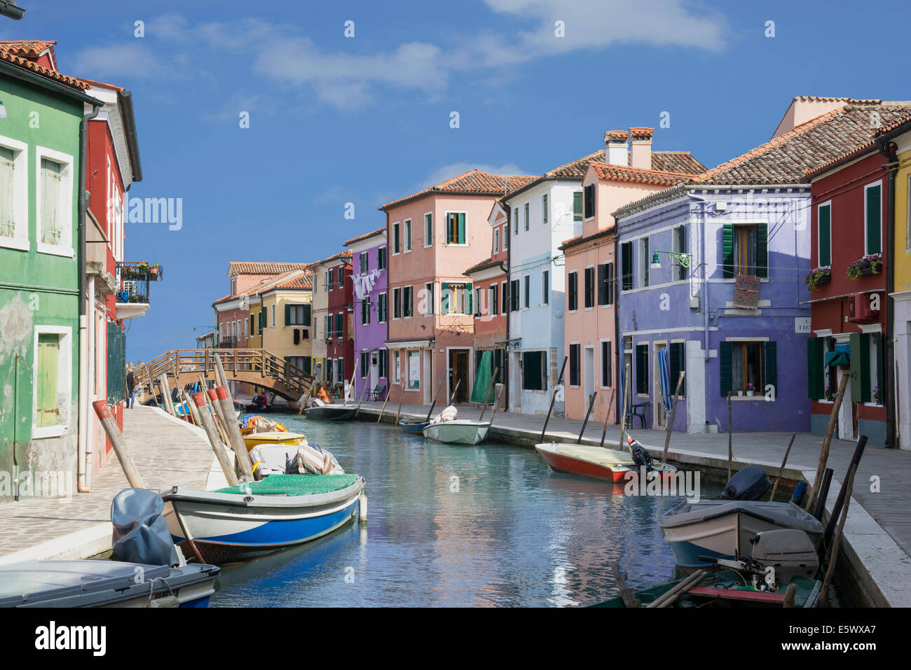 Pastel colored houses and boats on canal, Burano, Venice, Veneto, Italy Stock Photo