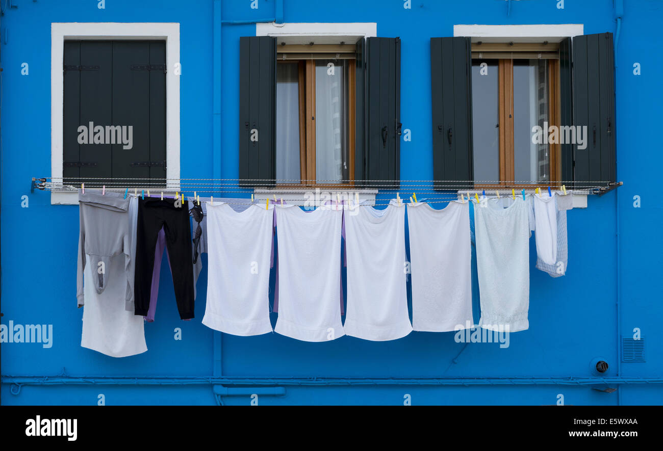 Close up of laundry and blue painted house, Burano, Venice, Veneto, Italy Stock Photo