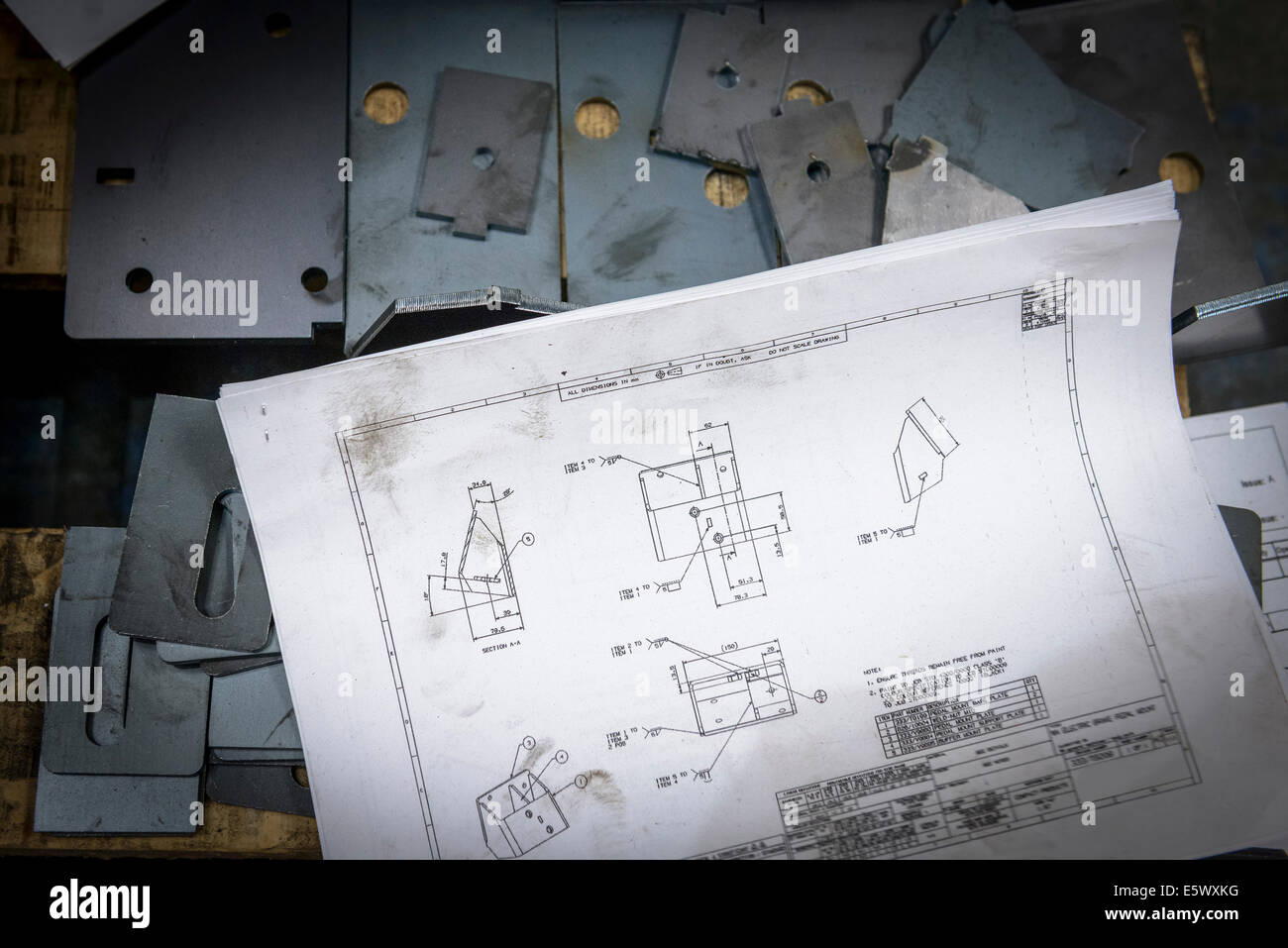 Engineering drawings and parts in sheet metal factory Stock Photo Alamy