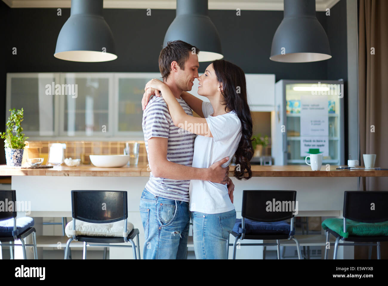 Portrait of amorous couple in embrace relaxing in the bar Stock Photo