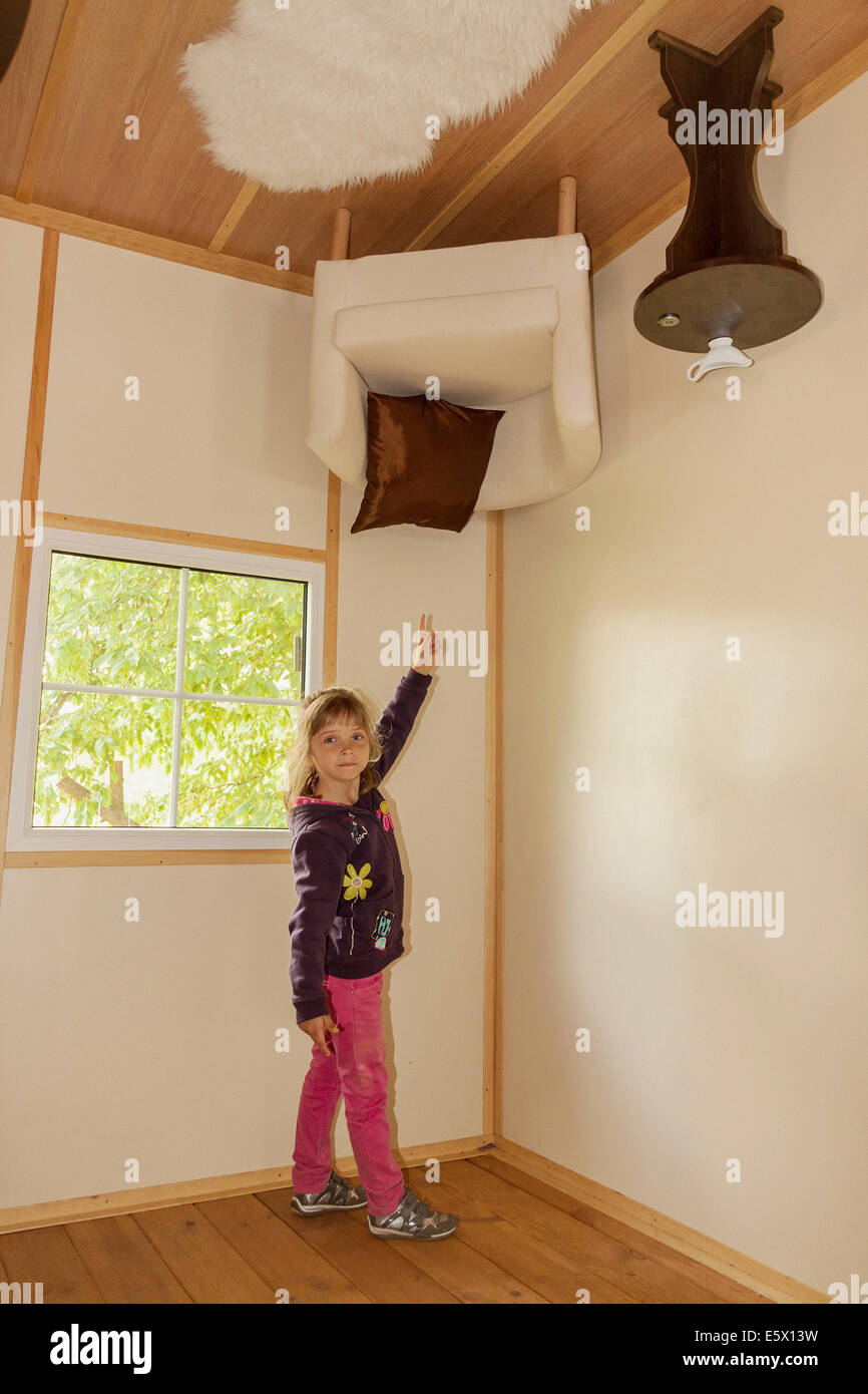 Girl inside upside-down house in Jastrzębia Góra, Poland Stock Photo ...
