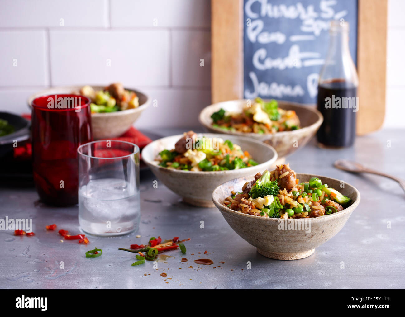 Cafe counter with bowls of fried rice with sausage and egg Stock Photo