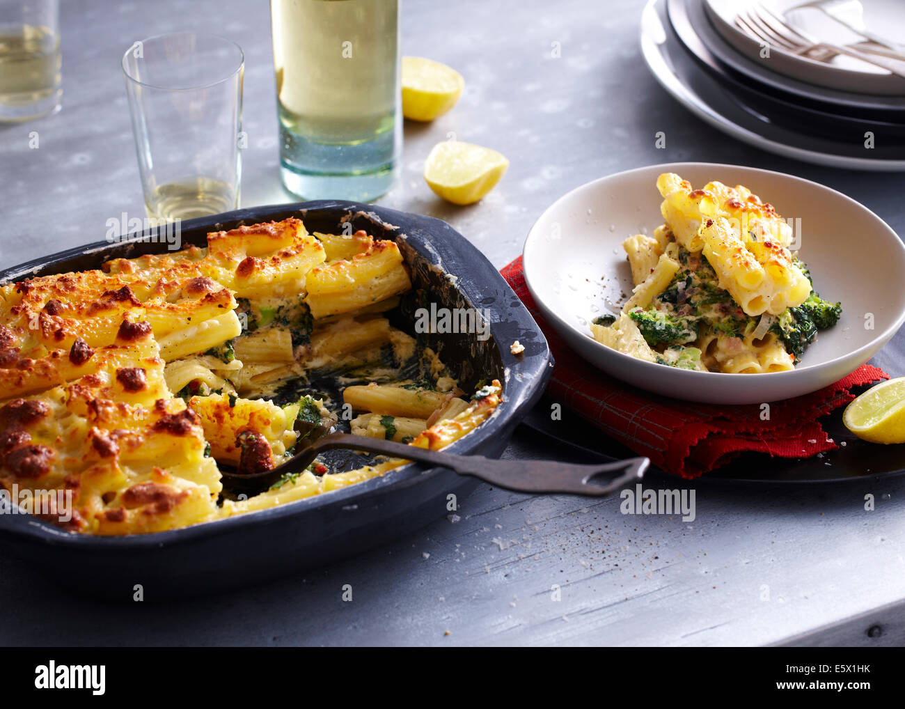 Baking tin and bowl serving of pasticcio Stock Photo