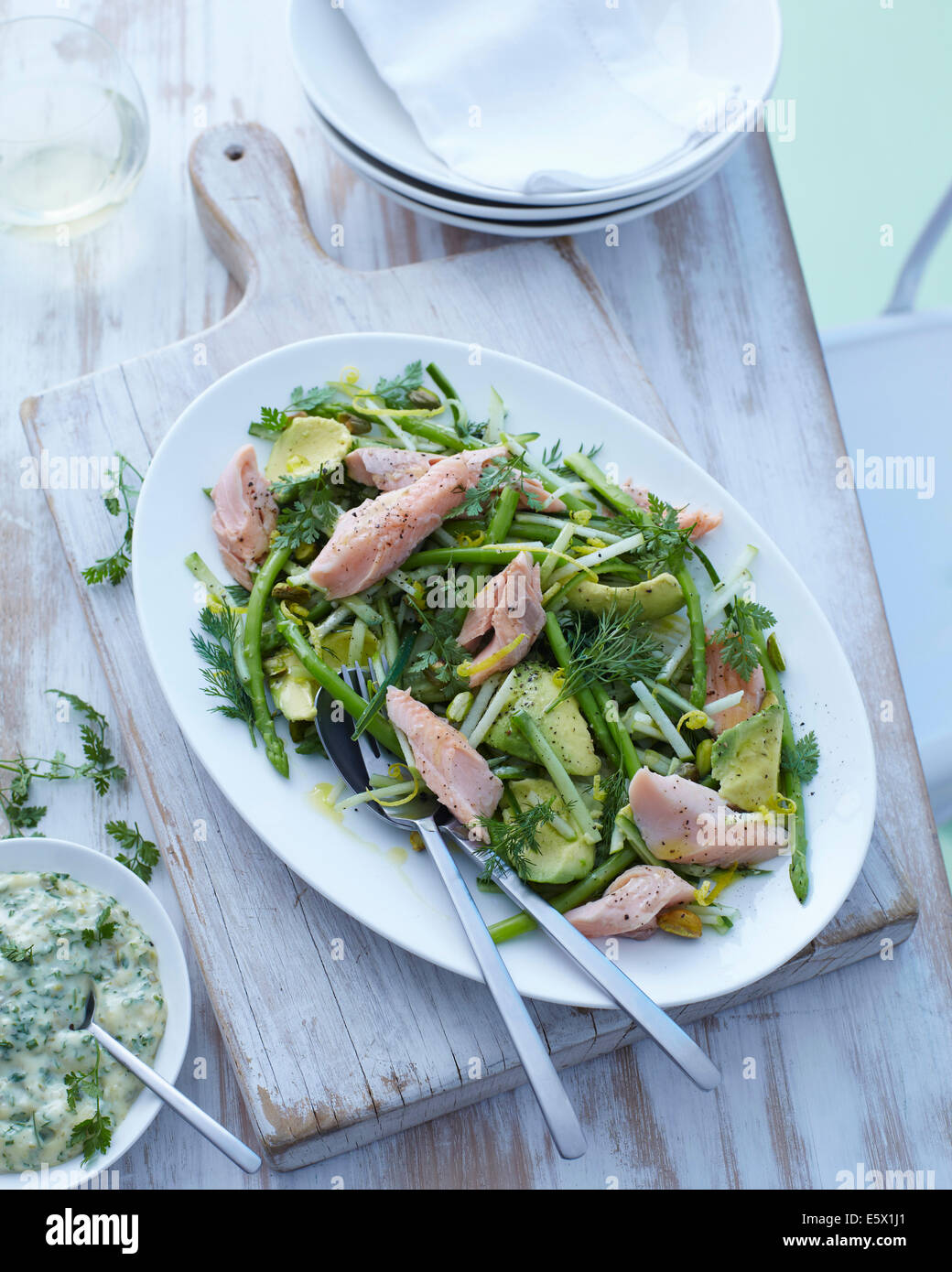 Plate of asparagus, avocado and dill salad with trout Stock Photo
