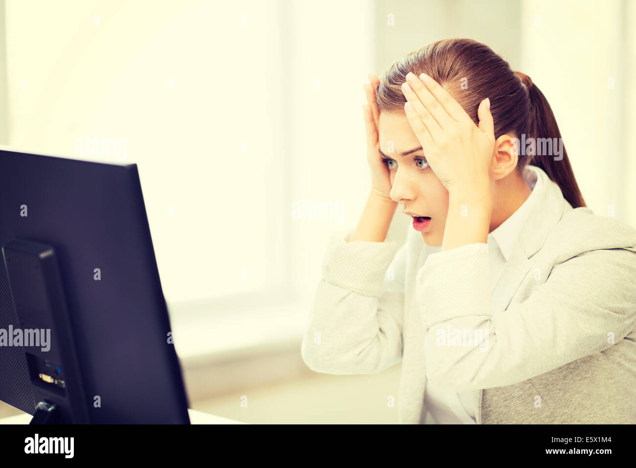 stressed student with computer in office Stock Photo - Alamy