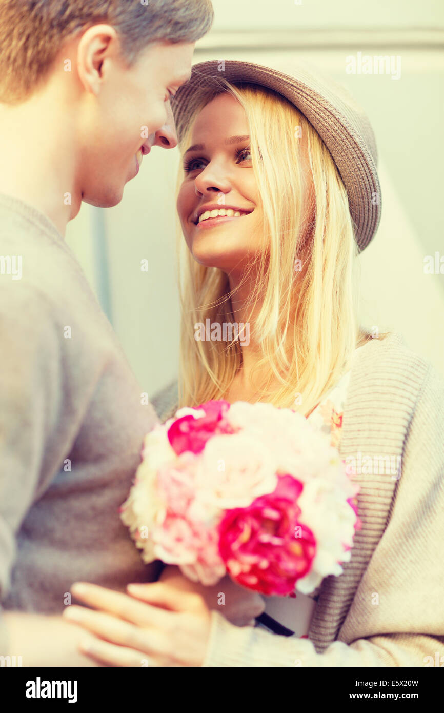happy couple with flowers in the city Stock Photo - Alamy