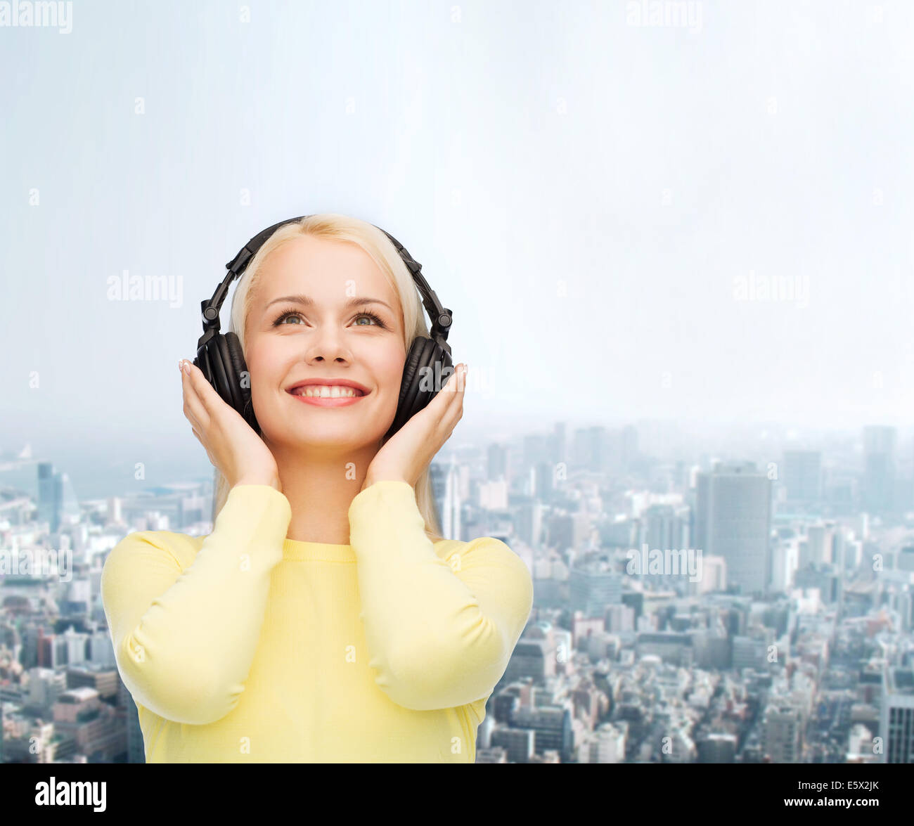 smiling young woman with headphones Stock Photo - Alamy