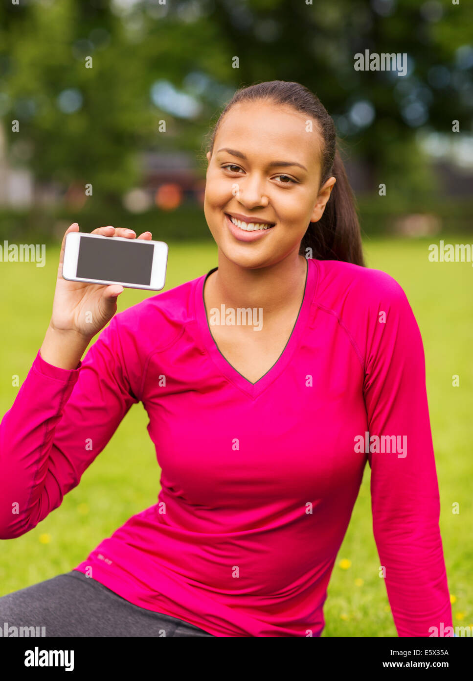smiling african american woman with smartphone Stock Photo - Alamy