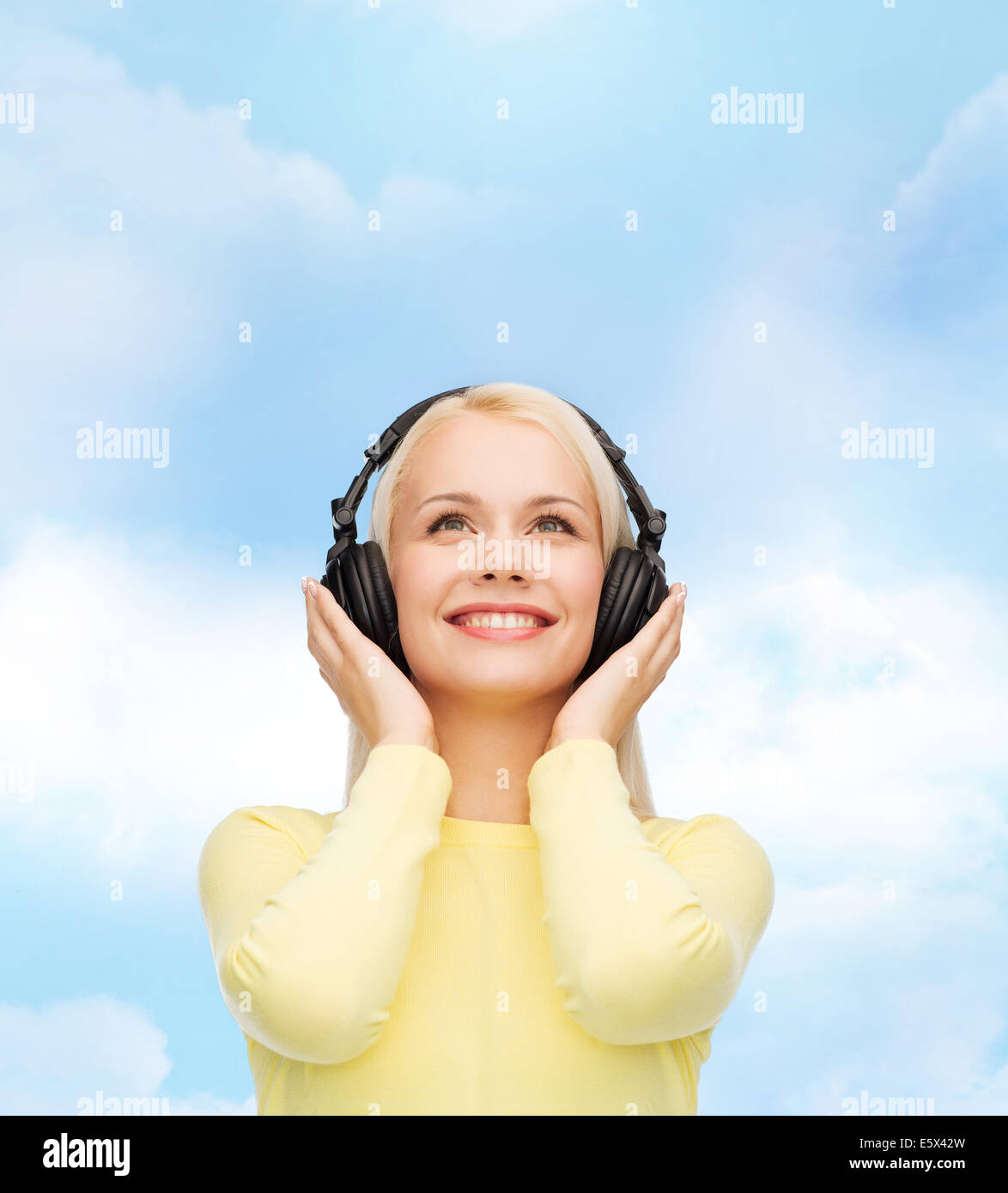 smiling young woman with headphones Stock Photo - Alamy