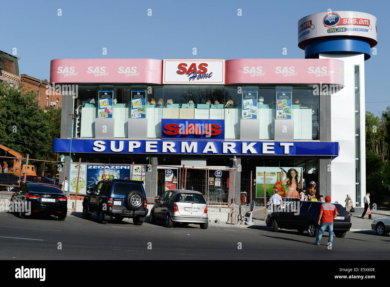 Cars park in front of a SAS supermarket in Yerevan, Armenia, 22 June