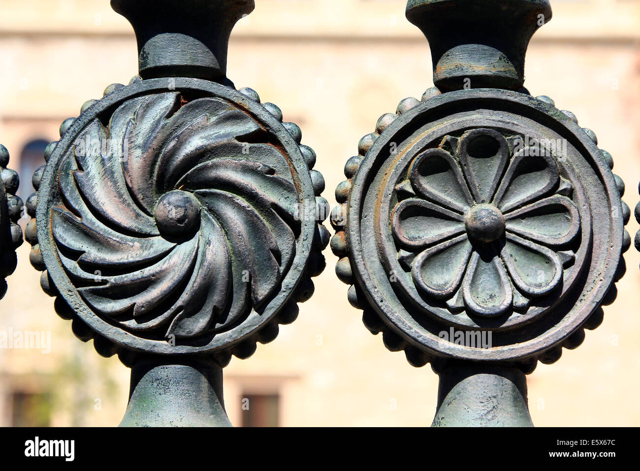 decorative details in an old iron fence Stock Photo