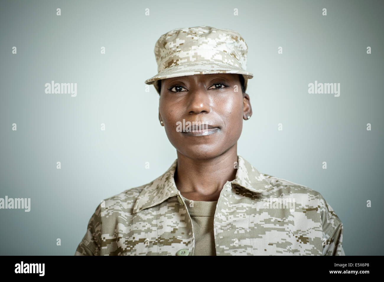 Studio portrait of confident female soldier Stock Photo