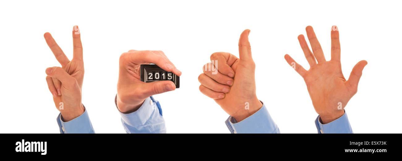 Male hands with analog pedometer display figuring the year 2015 Stock Photo
