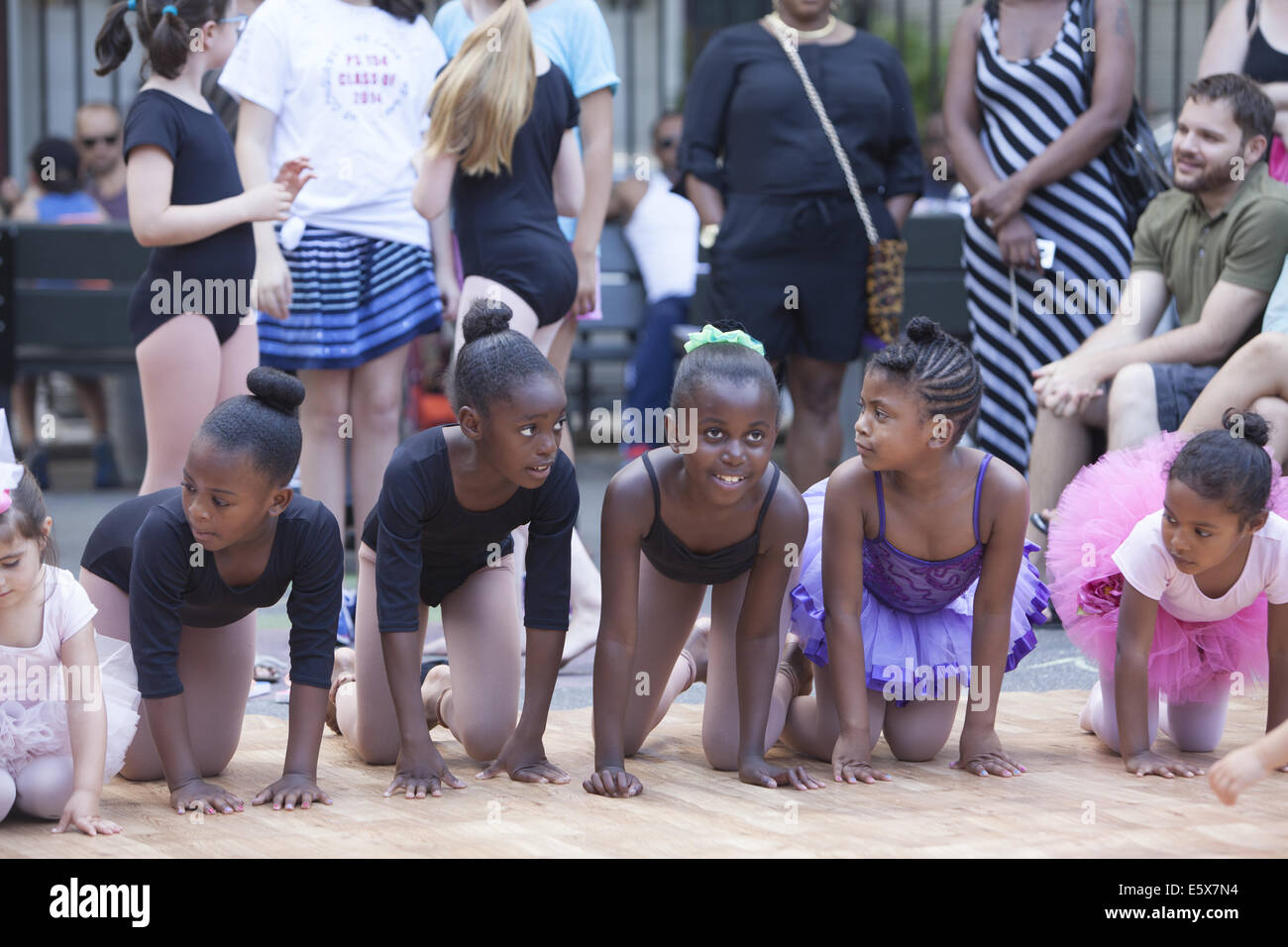 Young dancers from a local dance studio perform for the community at a