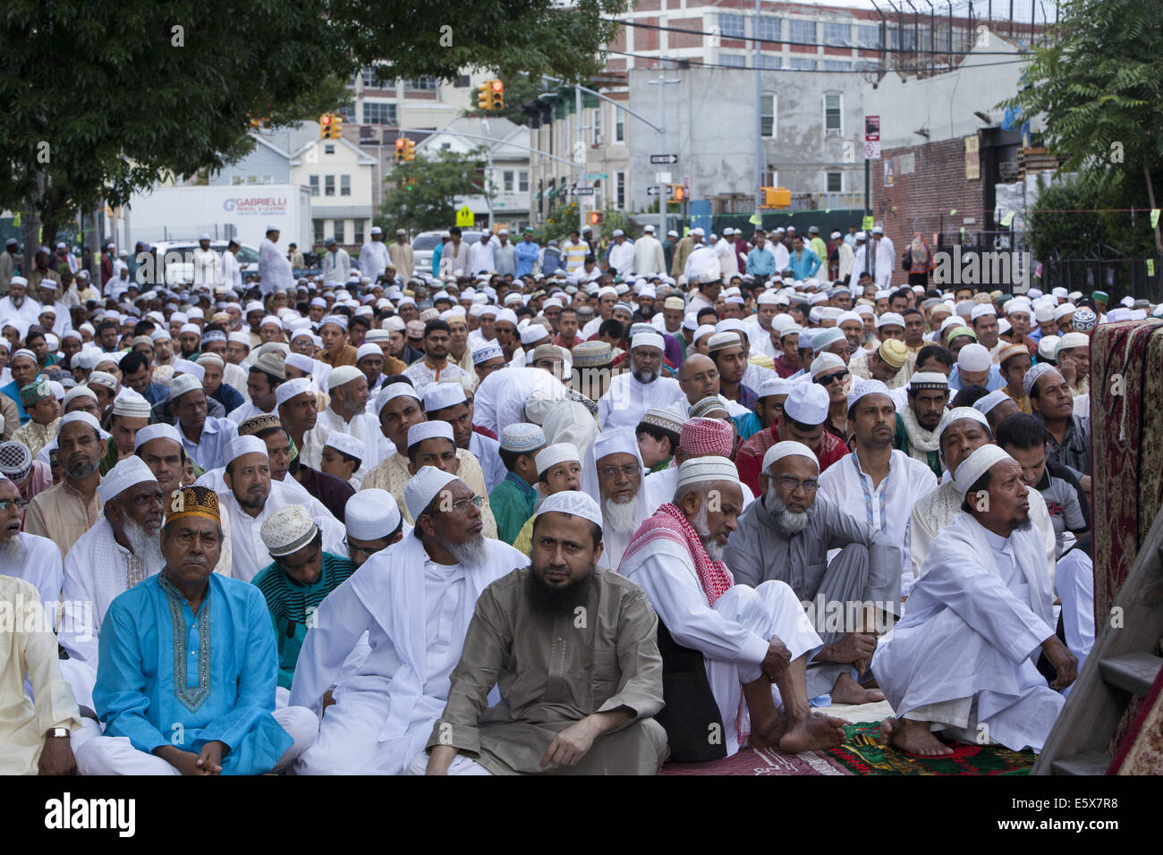 Morning prayers on the street during the Eid holiday after Ramadan in 'Little Bangladesh' in the Kensington neighborhood in Broo Stock Photo