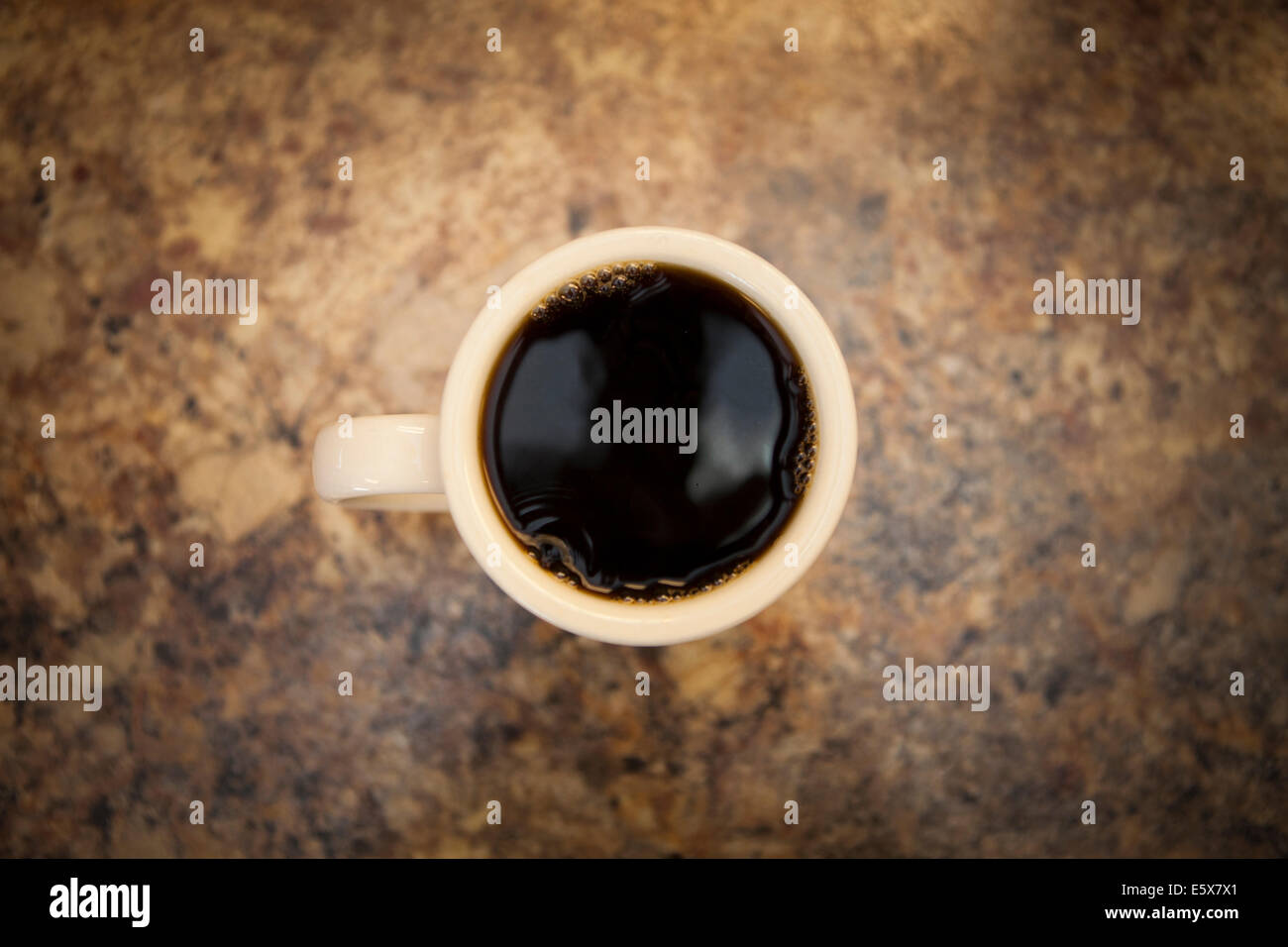 Overhead view of cup of black coffee on cafe counter Stock Photo - Alamy