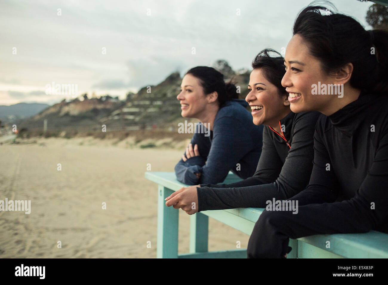 Joggers enjoying view on beach Stock Photo