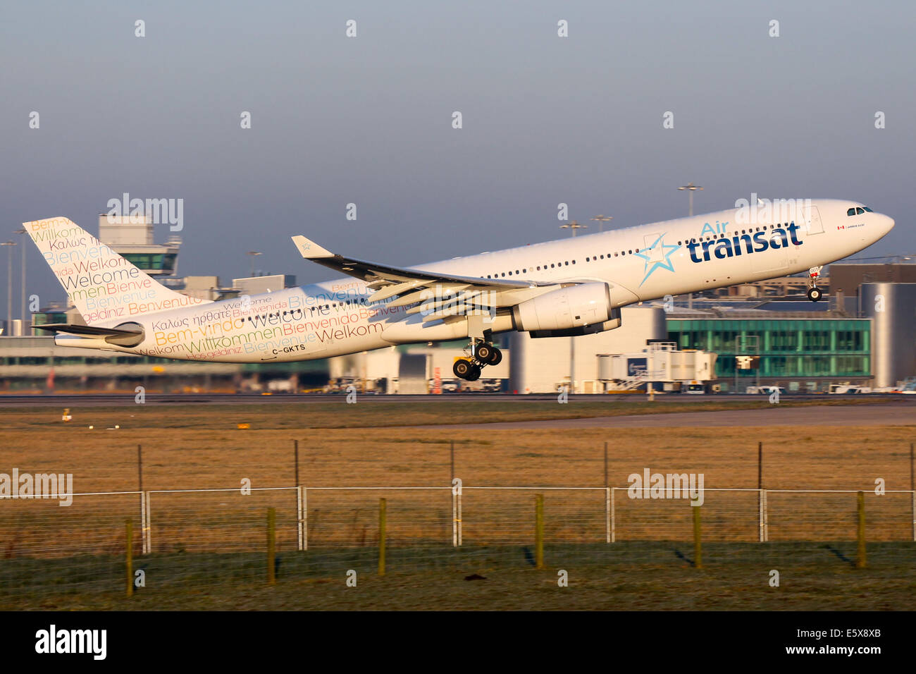 Air Transat Airbus A330-300 climbs away from runway 05L at Manchester airport. Stock Photo