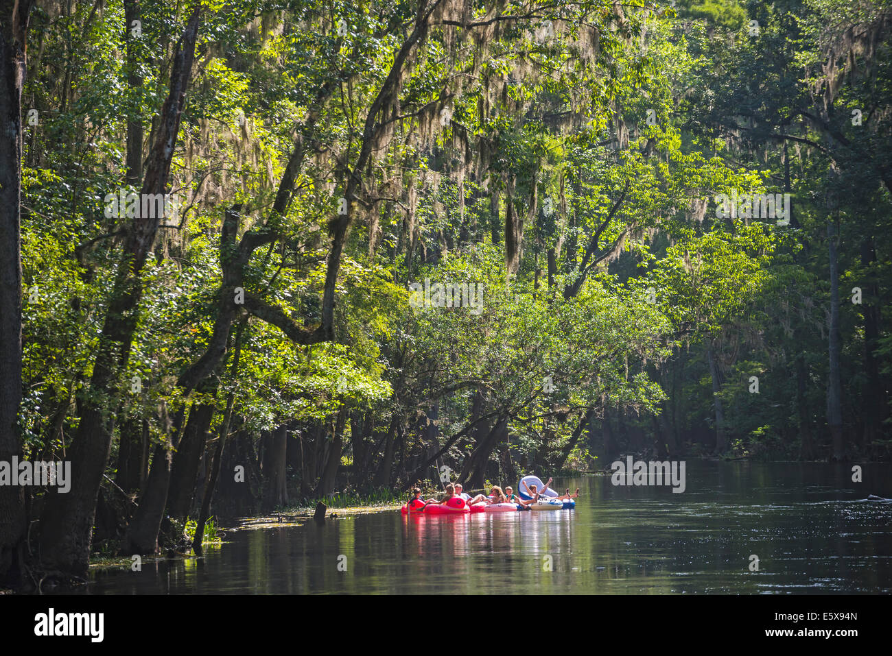 Tubing down the Ichetucknee River in North Florida is a great way to spend the 4th of July holiday. Stock Photo