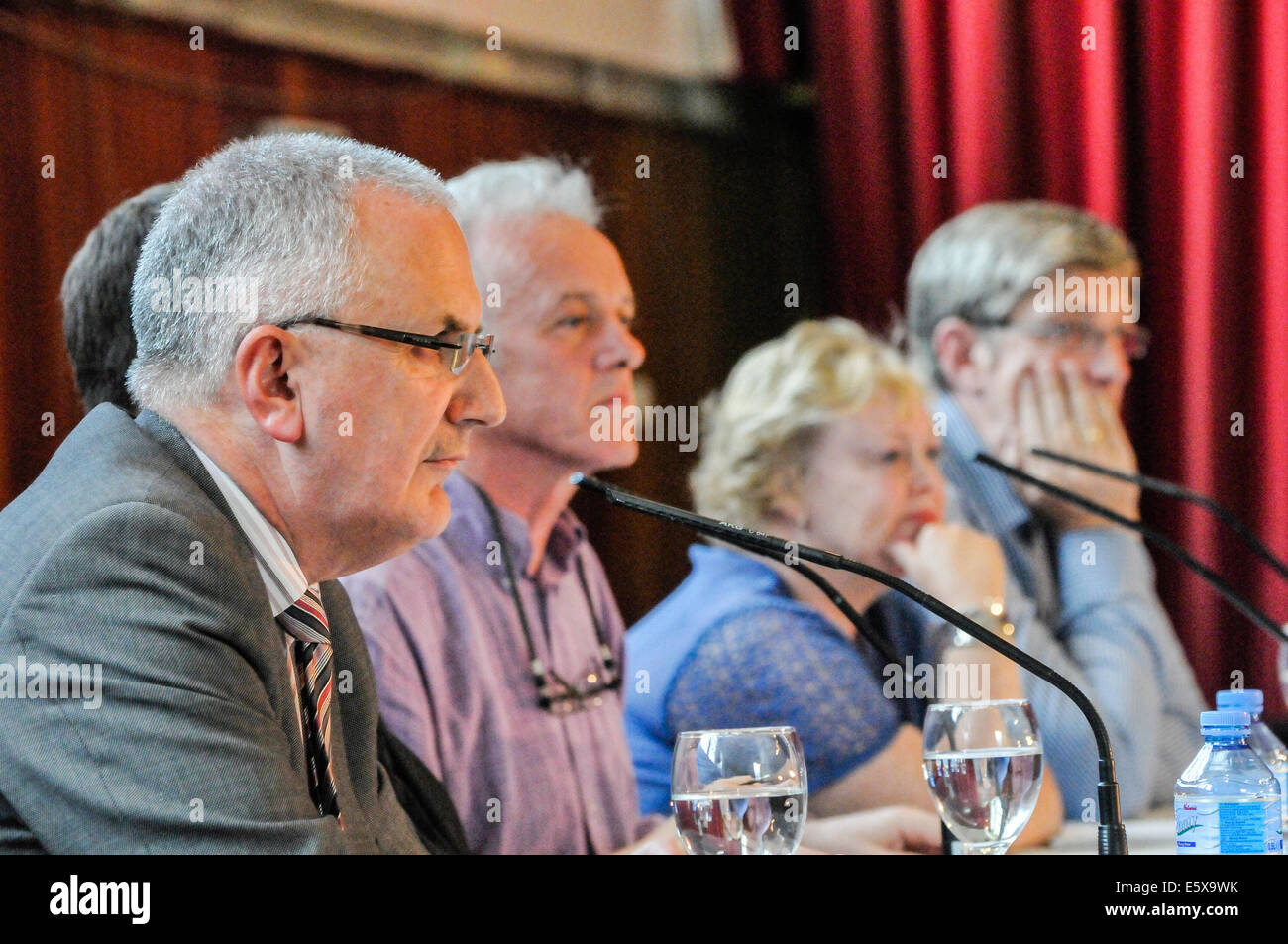 Belfast, Northern Ireland. 6th Aug 2014 - John O'Dowd, Danny Kennedy, Father Tim Bartlett and Rev Lesley Carroll in discussion at West Belfast Talks Back, chaired by Noel Thompson. Credit:  Stephen Barnes/Alamy Live News Stock Photo