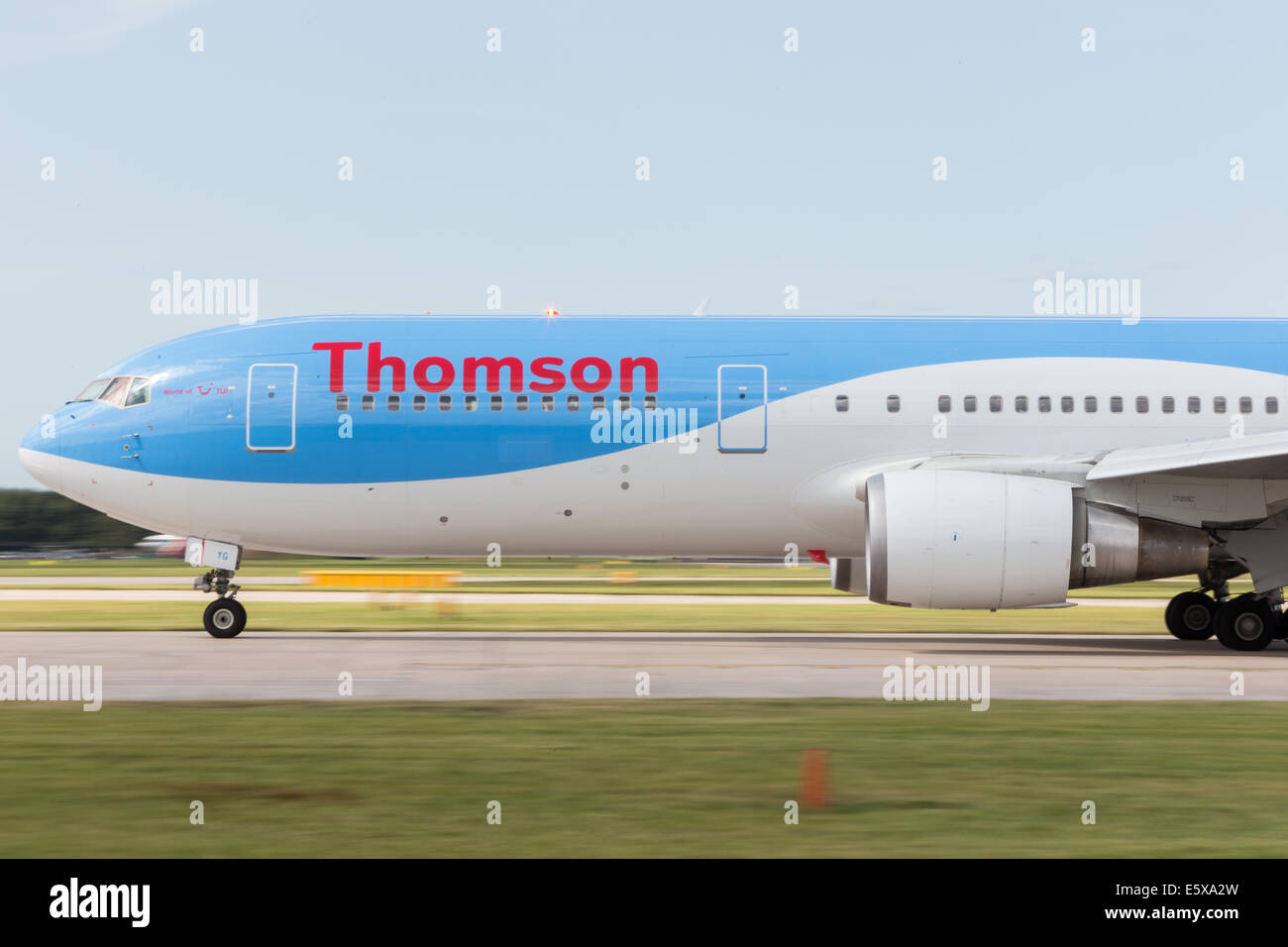 A Thomson flight taking off from an airport. Stock Photo