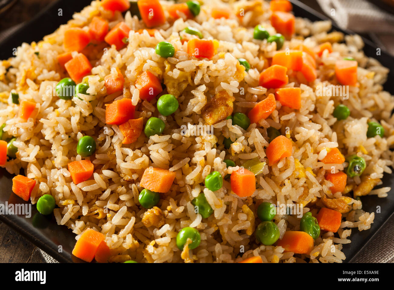Healthy Homemade Fried Rice with Carrots and Peas Stock Photo