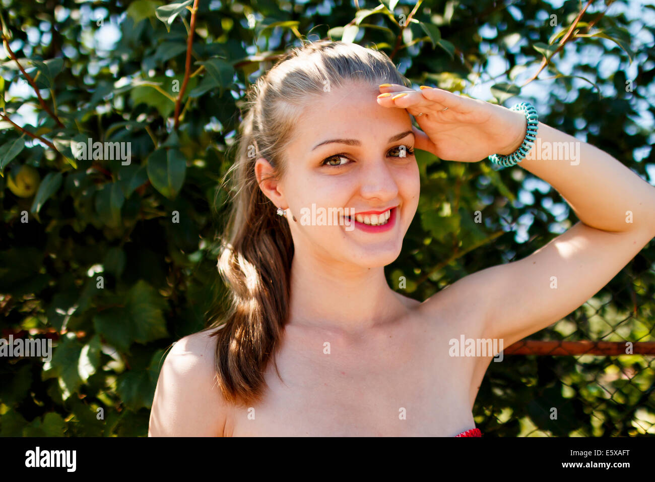 young beautiful happy woman blond at nature, looking forward Stock Photo