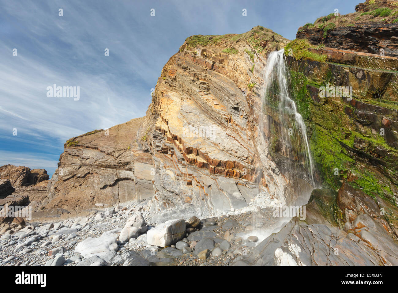 Waterfall on the beach at Sandymouth near bude Cornwall England UK Europe Stock Photo