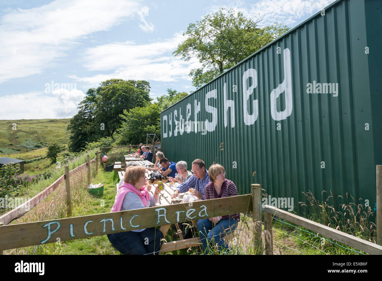 The Oyster Shed seafood shop and restaurant Carbost Isle of Skye Scotland with people sitting outside eating at tables Stock Photo
