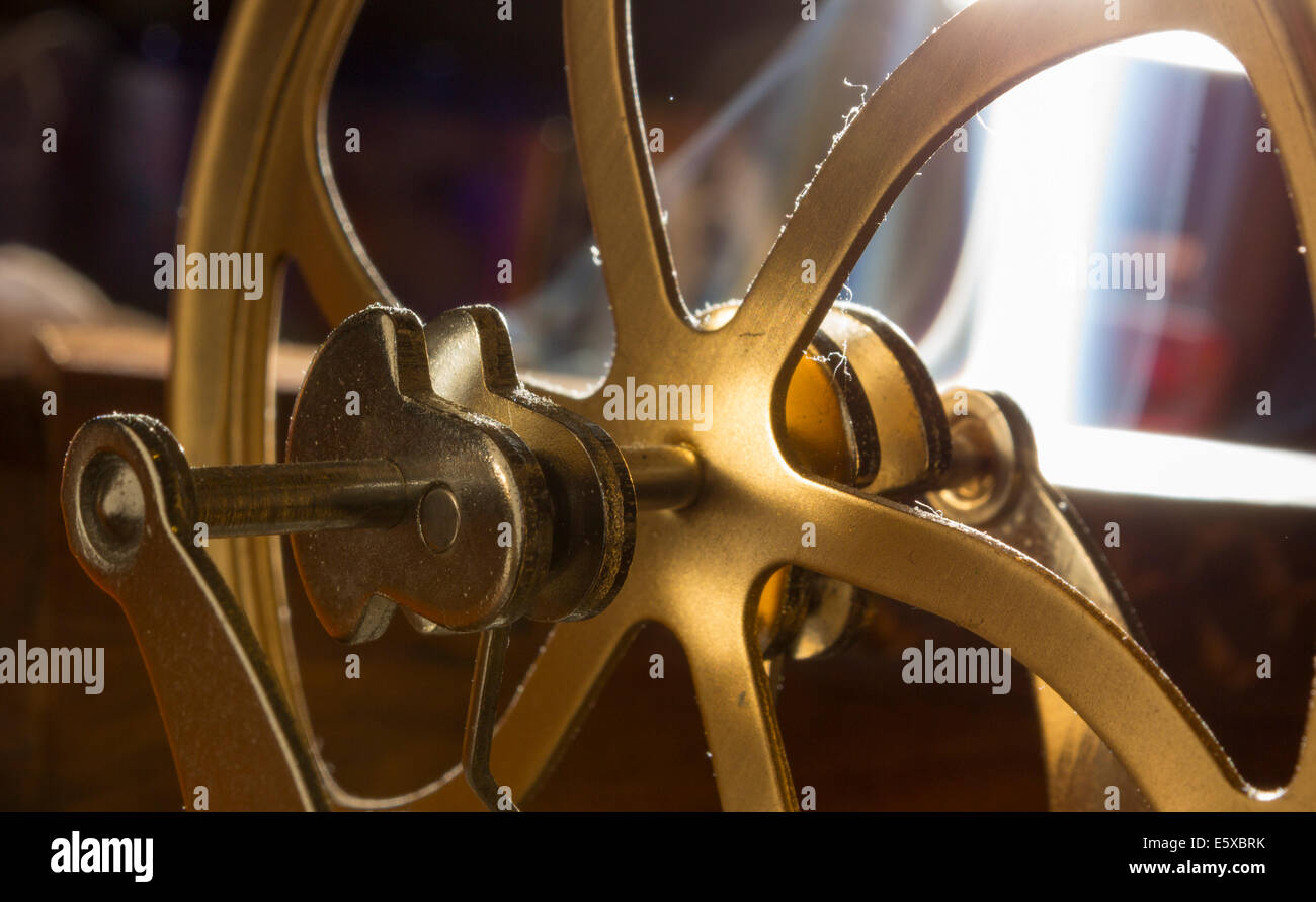 crank shafts and pulleys of machinery in bronze wheels Stock Photo