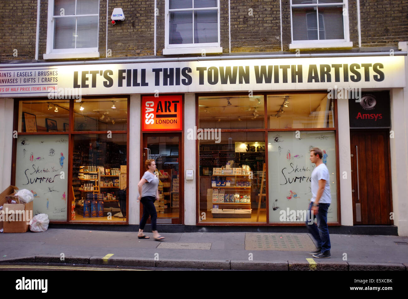 Art supplies shop in Soho called 'LET'S FILL THIS TOWN WITH ARTISTS' Stock Photo