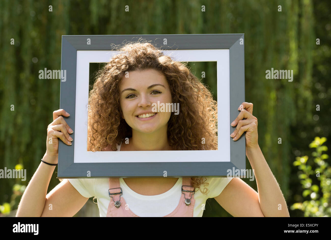 Portrait of teenage girl in a frame Stock Photo Alamy